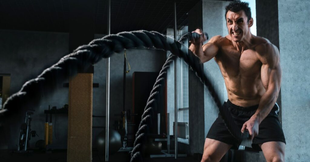man using battle rope