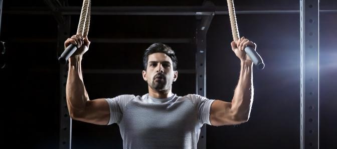 Man doing grip pull ups
